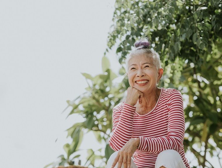 Thai senior hipster portrait beside the garden